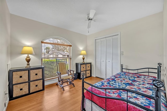 bedroom with a closet and wood finished floors