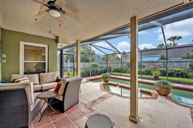 view of patio / terrace featuring ceiling fan, a fenced backyard, a lanai, an outdoor hangout area, and a pool with connected hot tub