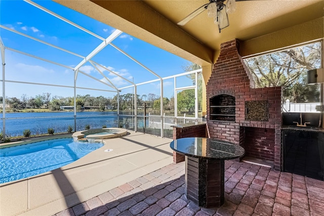 view of patio / terrace with area for grilling, glass enclosure, ceiling fan, a water view, and a pool with connected hot tub