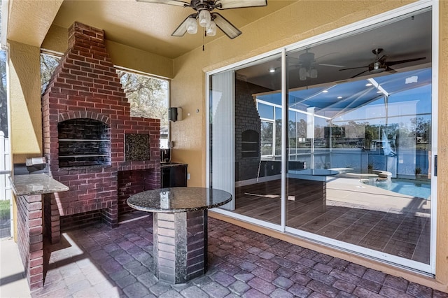 view of patio featuring ceiling fan, an outdoor brick fireplace, a lanai, and an outdoor pool