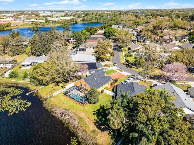 drone / aerial view featuring a water view and a residential view