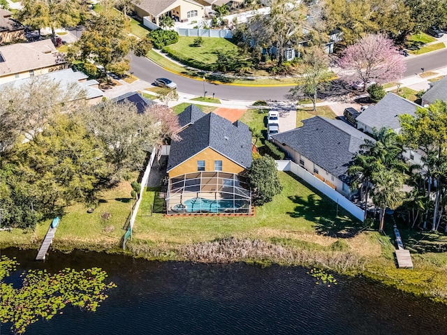 birds eye view of property featuring a residential view and a water view