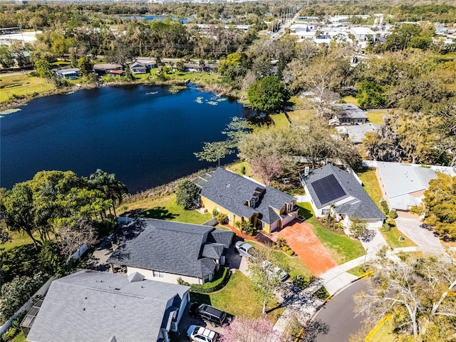 bird's eye view featuring a water view and a residential view