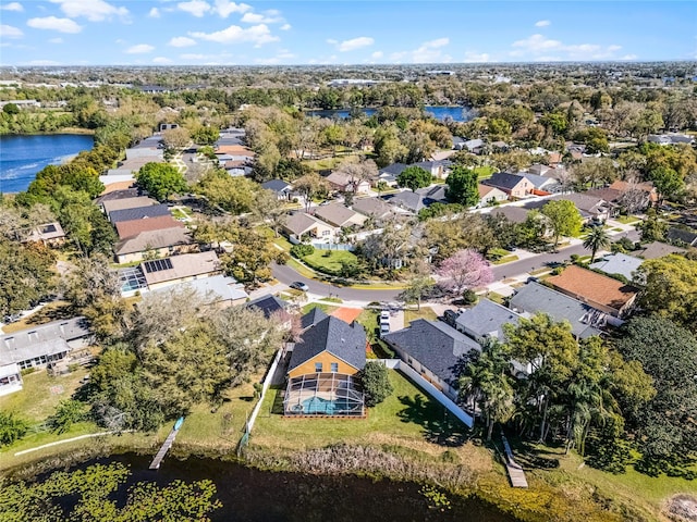 birds eye view of property with a water view and a residential view