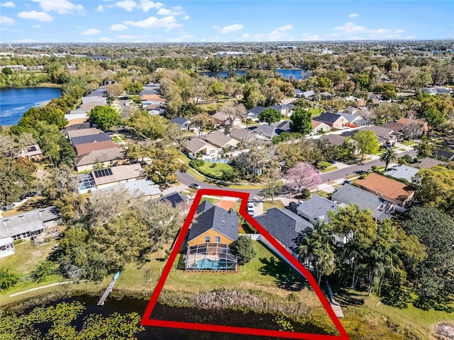 bird's eye view featuring a water view and a residential view