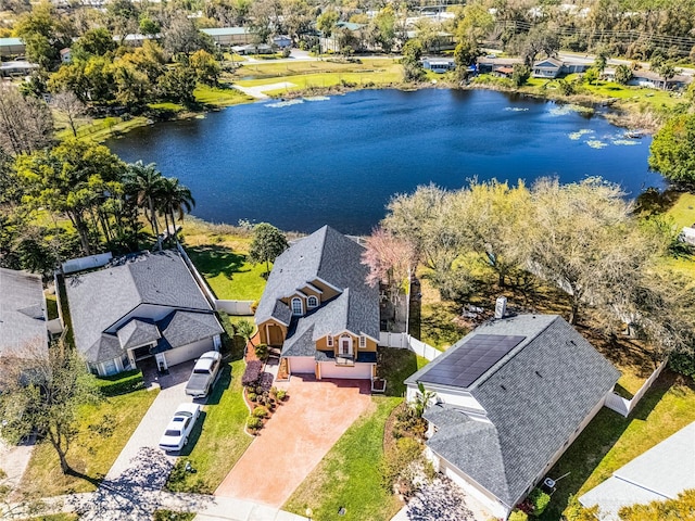 bird's eye view featuring a residential view and a water view