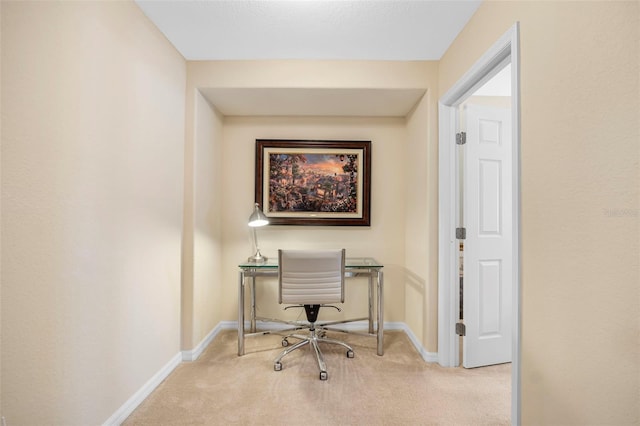 home office featuring light colored carpet and baseboards