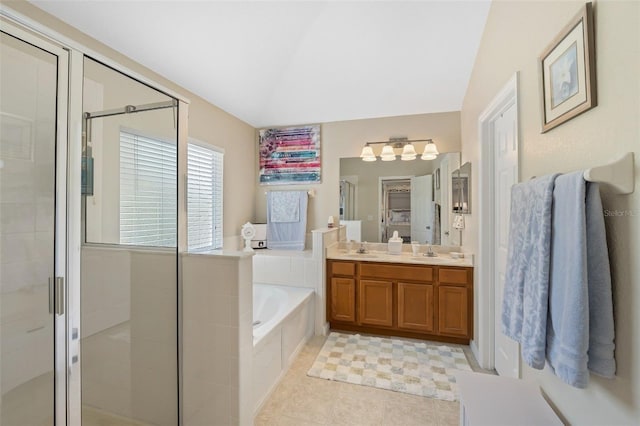 full bath featuring a stall shower, a sink, and a bath