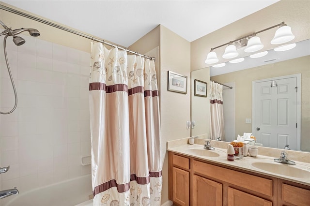 full bath with double vanity, shower / tub combo, visible vents, and a sink