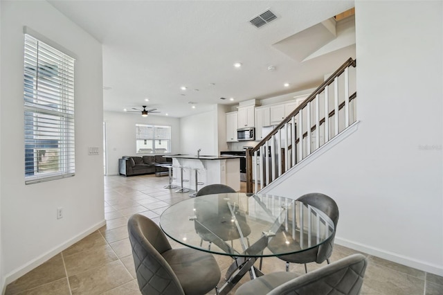 dining space with recessed lighting, visible vents, a ceiling fan, light tile patterned flooring, and baseboards