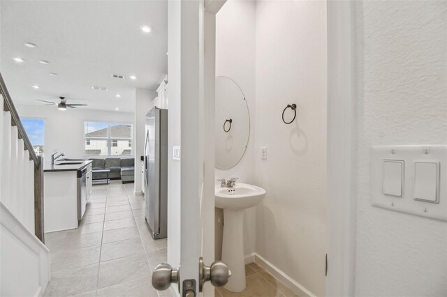 bathroom with tile patterned flooring, a sink, visible vents, and recessed lighting