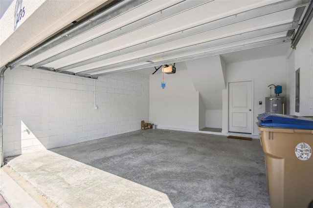 garage featuring water heater and a garage door opener