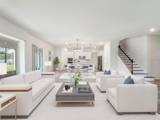 living area with recessed lighting and stairs