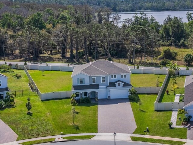 birds eye view of property with a water view