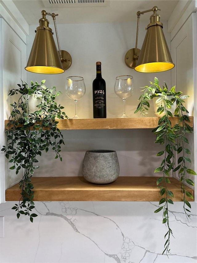 room details featuring a dry bar and visible vents