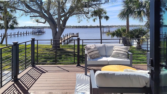 deck featuring a dock and a water view