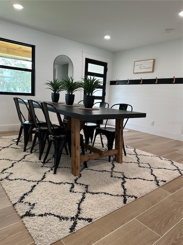 dining space with recessed lighting, light wood-style flooring, and baseboards