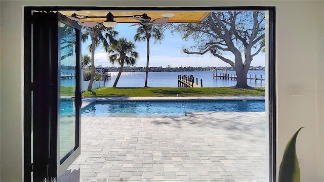 view of pool featuring a water view