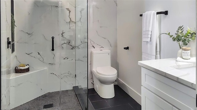 bathroom with vanity, tile patterned floors, toilet, and a marble finish shower