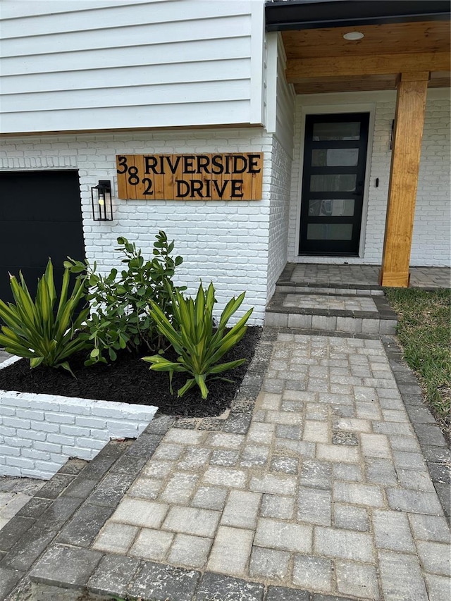 property entrance with brick siding