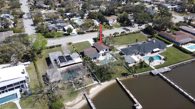 bird's eye view with a residential view and a water view