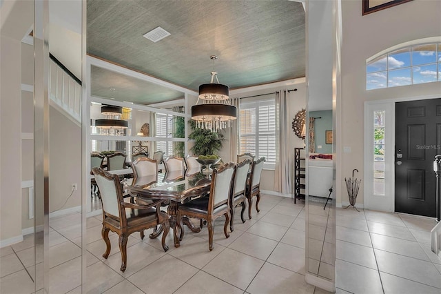 dining area featuring visible vents, baseboards, and light tile patterned flooring