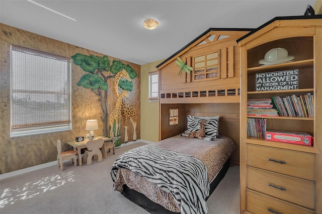 carpeted bedroom featuring baseboards