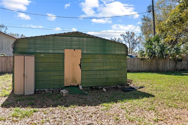 view of shed with fence