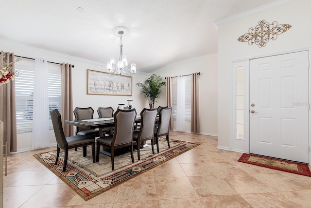 dining room with a chandelier, crown molding, baseboards, and light tile patterned floors