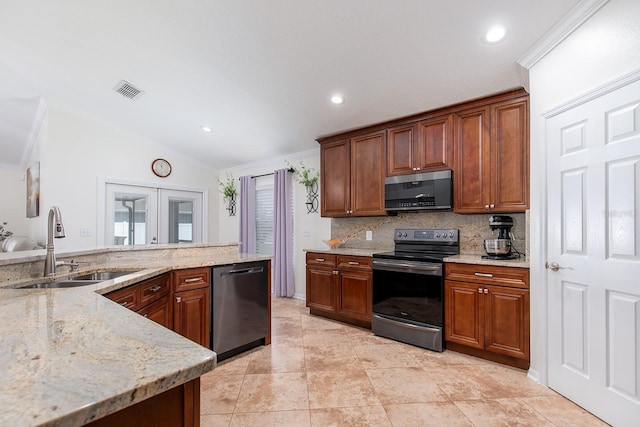 kitchen featuring dishwashing machine, range with electric cooktop, a sink, vaulted ceiling, and stainless steel microwave