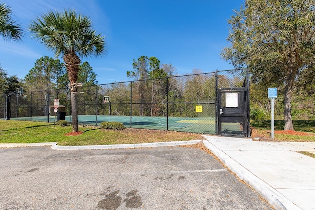 view of sport court featuring community basketball court, a gate, and fence