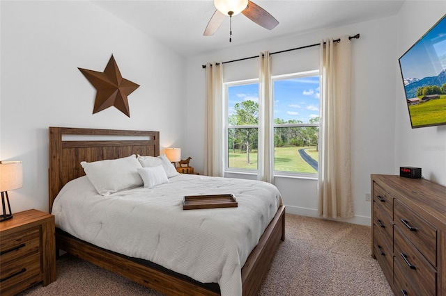 5500 State Road 33, Clermont, FL 34714 - bedroom featuring light carpet, baseboards, and a ceiling fan