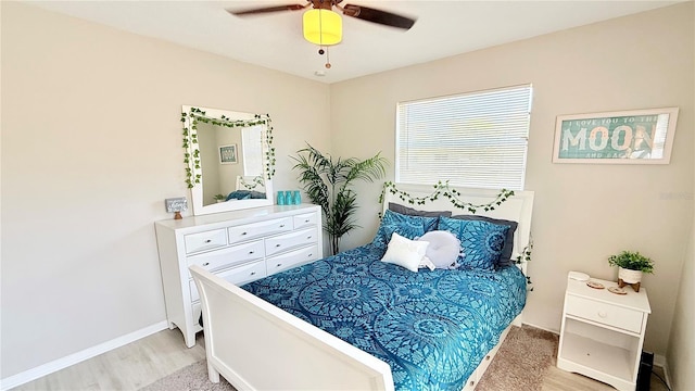 1420 Continental Dr, Daytona Beach, FL 32117 - bedroom with light wood-style flooring, baseboards, and ceiling fan