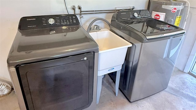 1420 Continental Dr, Daytona Beach, FL 32117 - laundry room featuring washer / clothes dryer and water heater
