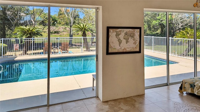 view of swimming pool with a fenced in pool