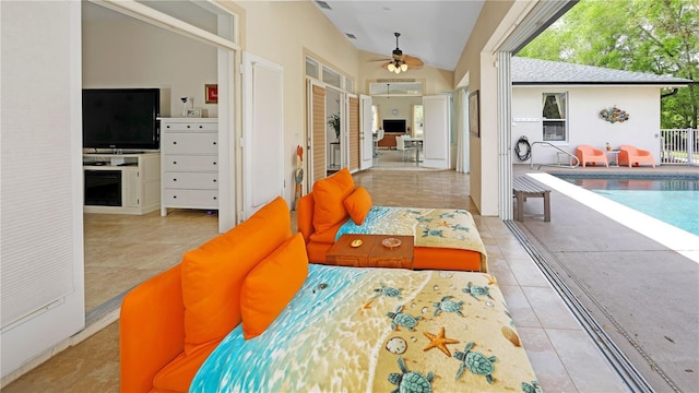 interior space with lofted ceiling, access to outside, and french doors