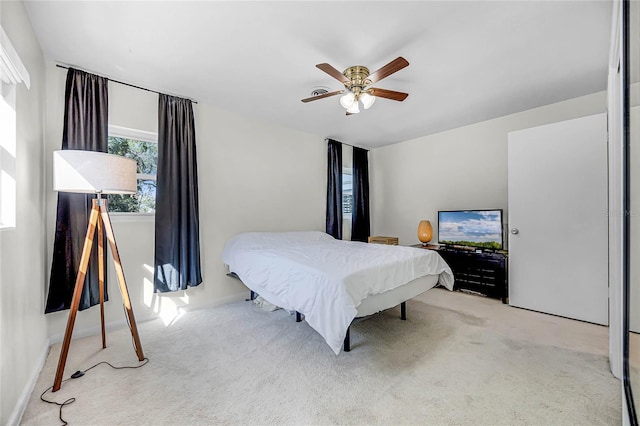 bedroom with ceiling fan and carpet flooring