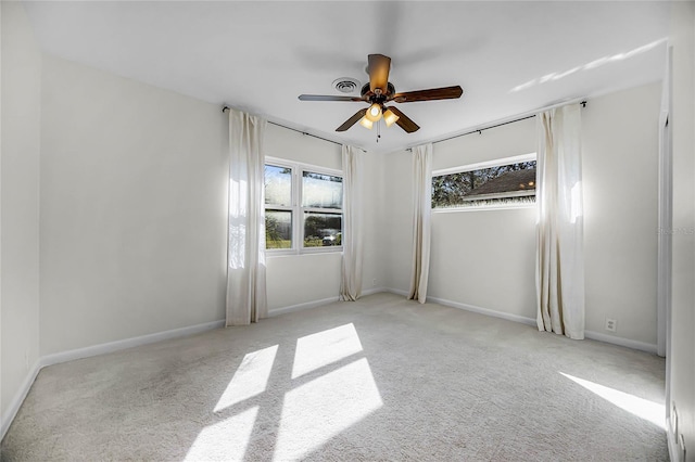 unfurnished room featuring baseboards, a ceiling fan, and carpet flooring