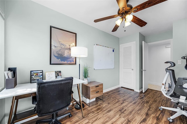 office with ceiling fan, baseboards, and wood finished floors