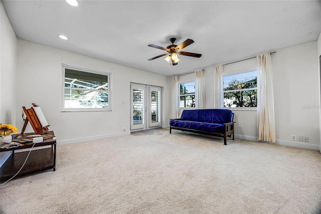 sitting room with baseboards, carpet floors, recessed lighting, and a healthy amount of sunlight