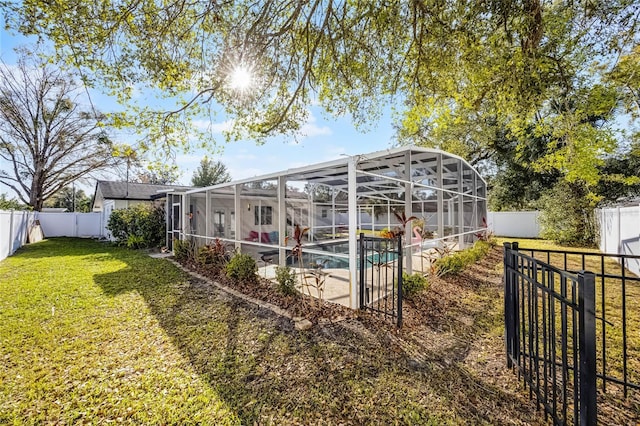 view of outdoor structure with a fenced in pool and a fenced backyard