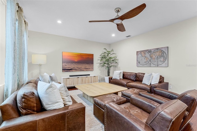 living area with visible vents, recessed lighting, a ceiling fan, and wood finished floors