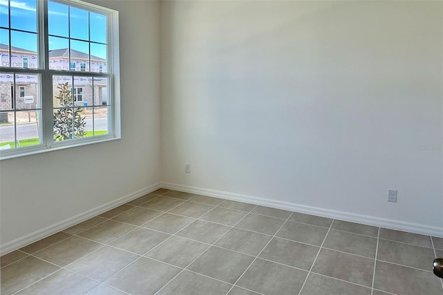 empty room featuring baseboards