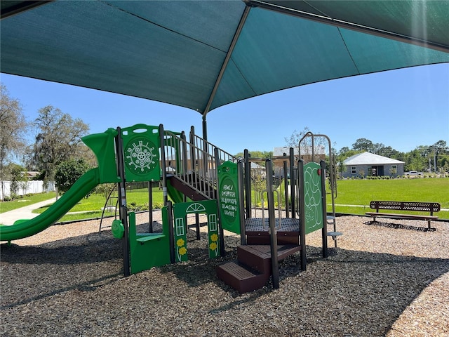 community play area with a lawn