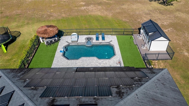 view of pool featuring a yard, a patio, a fenced in pool, and fence