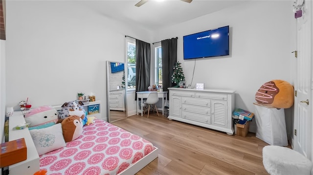 bedroom with light wood-style floors and ceiling fan