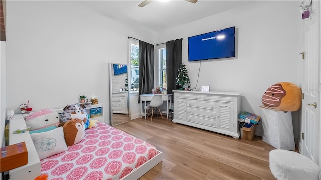 bedroom featuring a ceiling fan and light wood finished floors