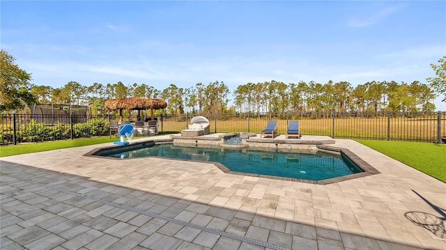 view of swimming pool featuring a patio, a fenced backyard, a yard, and a fenced in pool