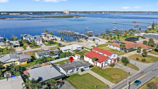 birds eye view of property with a residential view and a water view