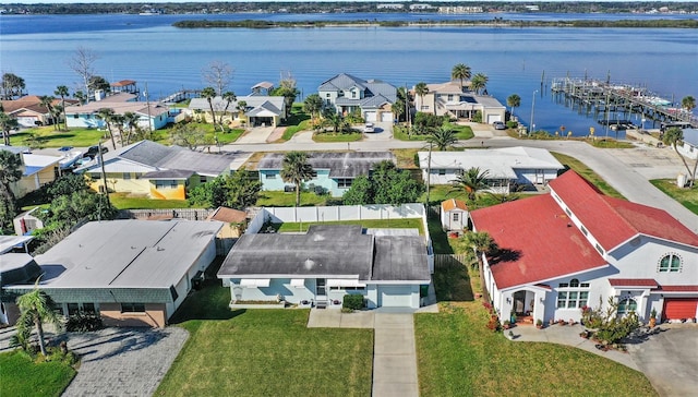 birds eye view of property featuring a water view and a residential view